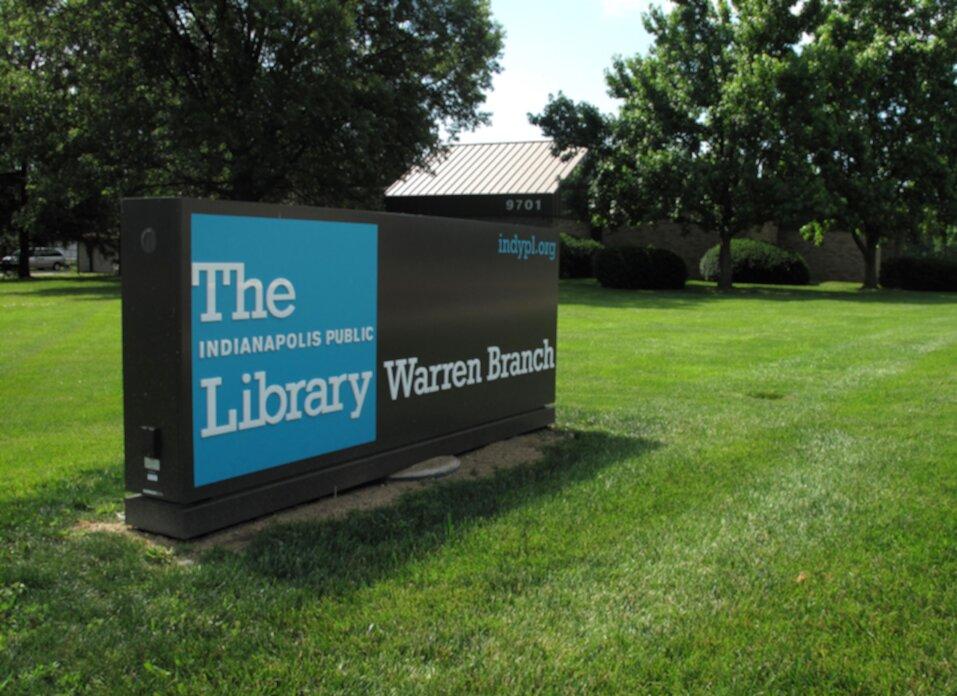A close up view of a sign that reads "Warren Branch."