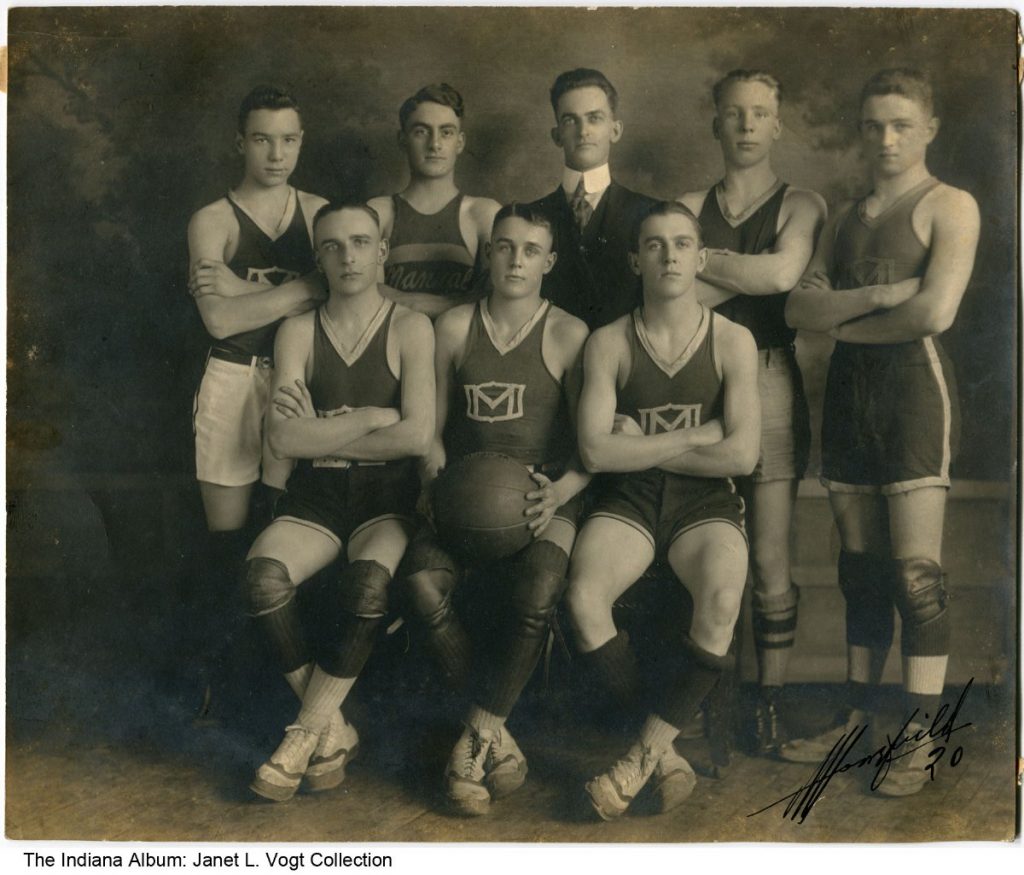 Two rows of young men wearing basketball uniforms. 