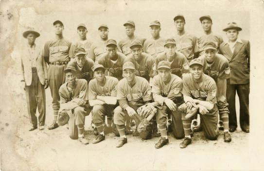 Three rows of men wearing baseball uniforms.