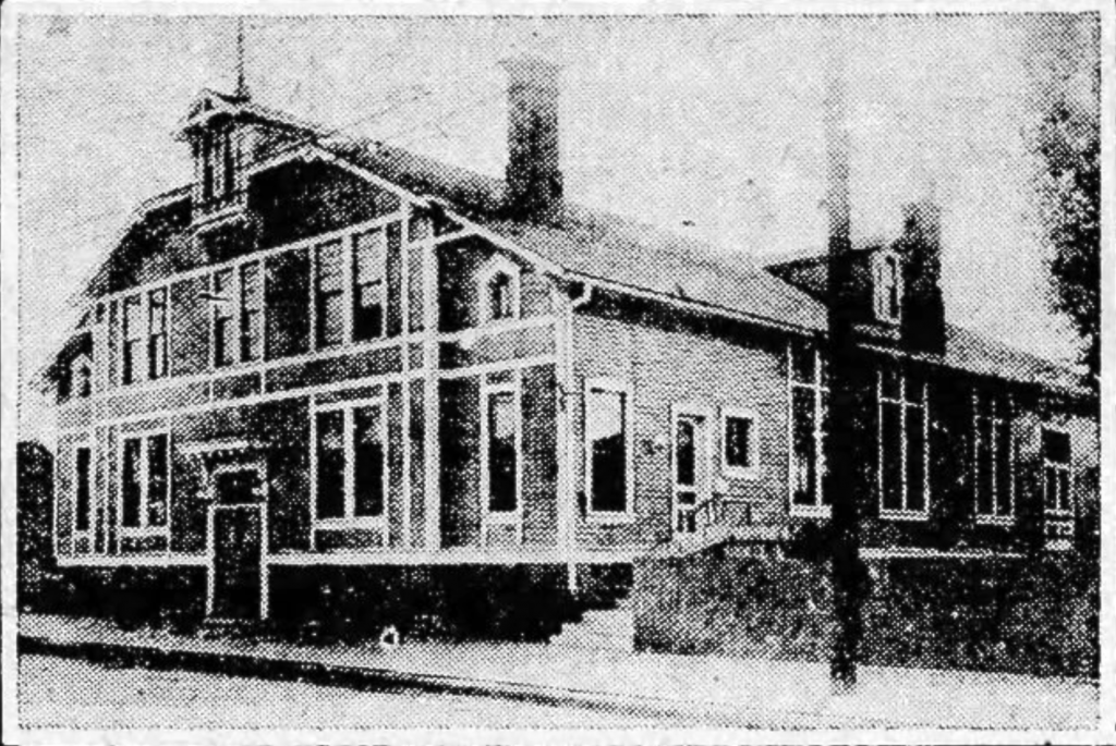 Grainy newspaper image showing a multistory building. 