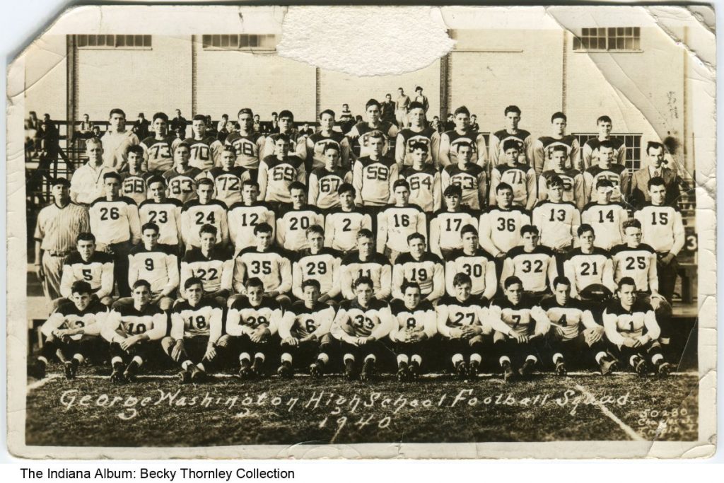 Five rows of young men in football uniforms. 