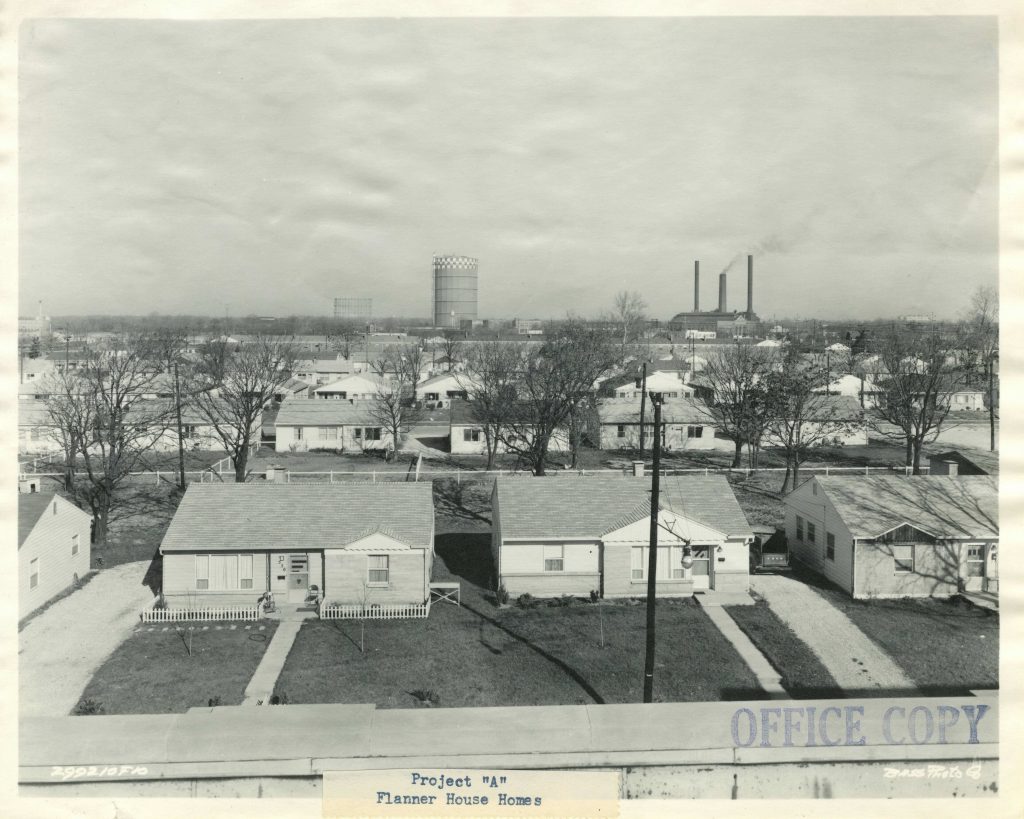 View showing the front of a row of small single story homes. 