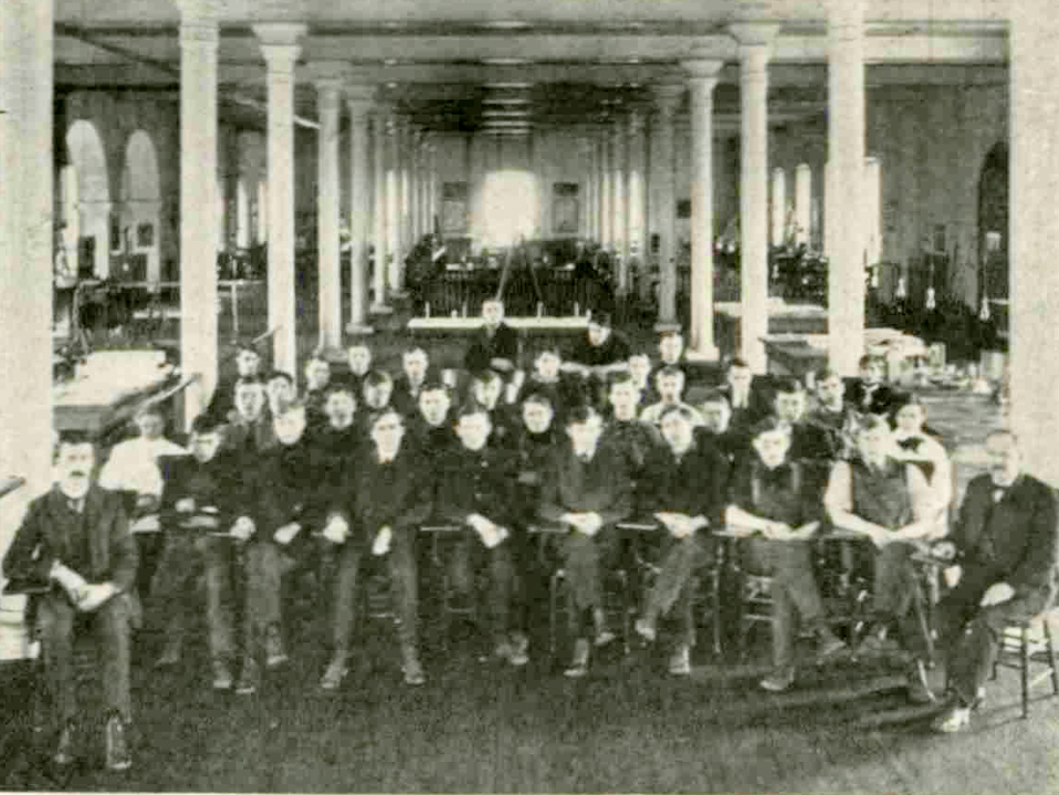 A group of male students pose for a group portrait.