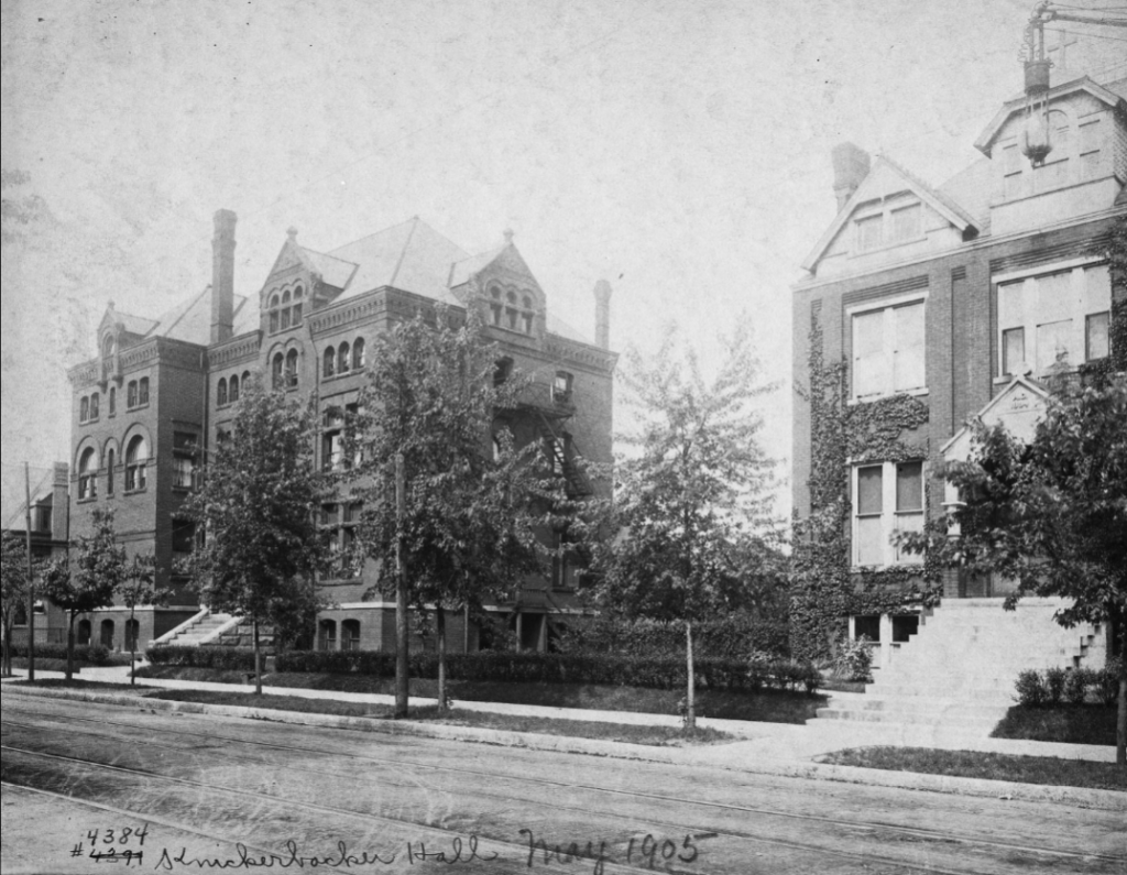 Two large, multi-story brick buildings next to each other.