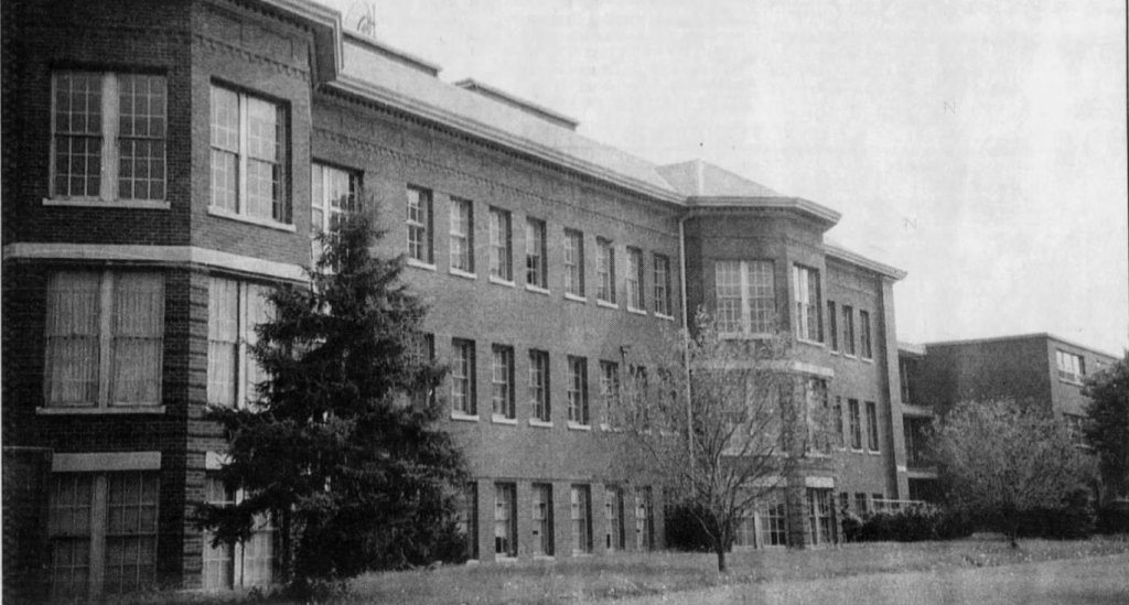Exterior of a three-story, brick institutional building.