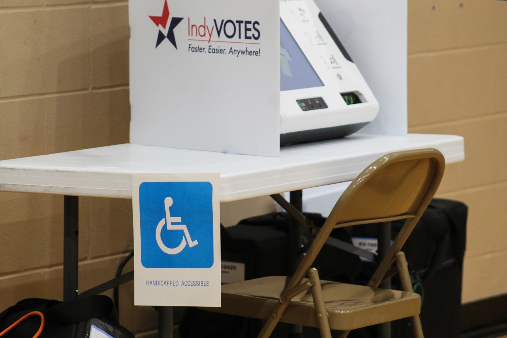 A voting booth with a "Handicapped Accessible" sign on it.